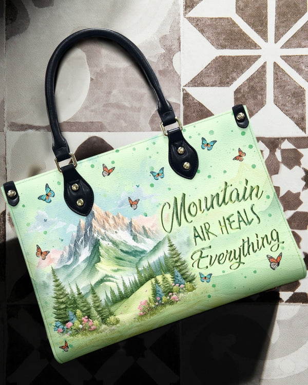 MOUNTAIN AIR HEALS EVERYTHING LEATHER HANDBAG - YHLN3110244